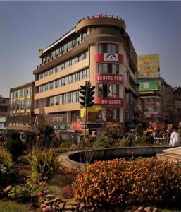 a building with a traffic light in front of it at Hotel Centre Point in Shillong