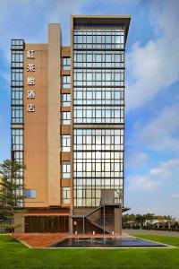 a large building with a sign on the front of it at Bridal Tea House Hotel-Free Welcome Drink in Guangzhou