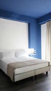 Krevet ili kreveti u jedinici u okviru objekta Hotel della Contrada