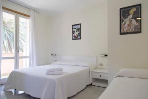 Postel nebo postele na pokoji v ubytování Residence Hotel Villa Mare
