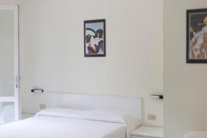 Postel nebo postele na pokoji v ubytování Residence Hotel Villa Mare