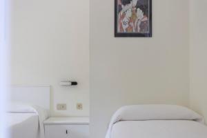 Postel nebo postele na pokoji v ubytování Residence Hotel Villa Mare