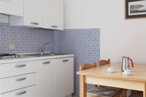 Kuchyň nebo kuchyňský kout v ubytování Residence Hotel Villa Mare