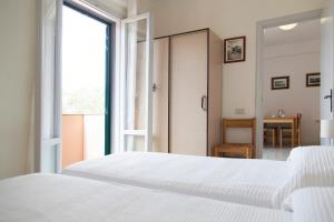 Postel nebo postele na pokoji v ubytování Residence Hotel Villa Mare