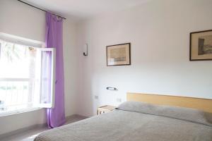 Postel nebo postele na pokoji v ubytování Residence Hotel Villa Mare
