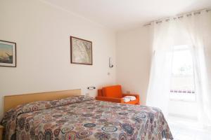 Postel nebo postele na pokoji v ubytování Residence Hotel Villa Mare