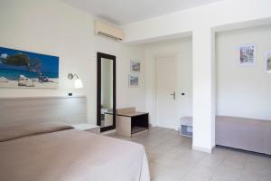 Postel nebo postele na pokoji v ubytování Residence Hotel Villa Mare