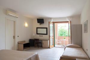 Postel nebo postele na pokoji v ubytování Residence Hotel Villa Mare