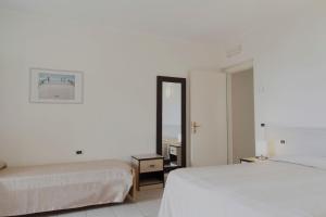 Postel nebo postele na pokoji v ubytování Residence Hotel Villa Mare