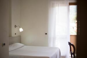 Postel nebo postele na pokoji v ubytování Residence Hotel Villa Mare