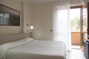 Postel nebo postele na pokoji v ubytování Residence Hotel Villa Mare