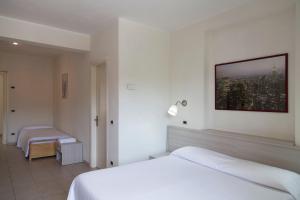 Postel nebo postele na pokoji v ubytování Residence Hotel Villa Mare