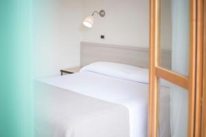 Postel nebo postele na pokoji v ubytování Residence Hotel Villa Mare