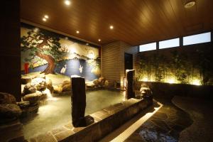Ein Sitzbereich in der Unterkunft Dormy Inn Korakuen