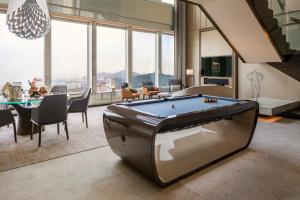a living room with a pool table in it at MGM Cotai in Macau