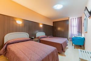 Postel nebo postele na pokoji v ubytování Hotel Monreal Jumilla + 37 fotografií