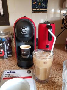 a coffee maker and a cup of coffee on a counter at Yvonne's Home Sde Boker in Midreshet Ben Gurion