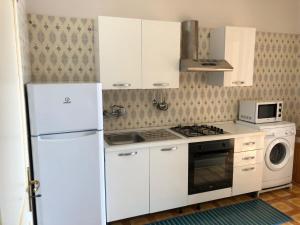 Kuchyň nebo kuchyňský kout v ubytování a casa di Manu + 28 fotografií