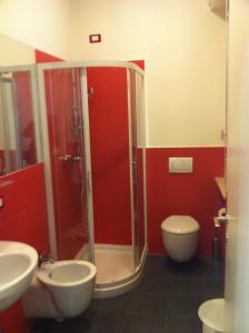a bathroom with a shower and a toilet at Romeo Design Rooms in Verona