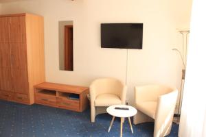 TV in/ali zabaviščno središče v nastanitvi Gasthaus Stefaner