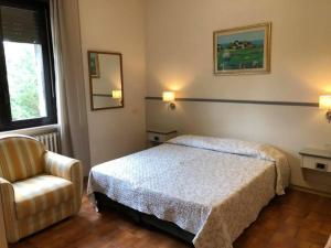 Postel nebo postele na pokoji v ubytování Hotel Ai Tufi