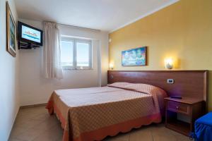 Postel nebo postele na pokoji v ubytování Hotel Ristorante Colleverde