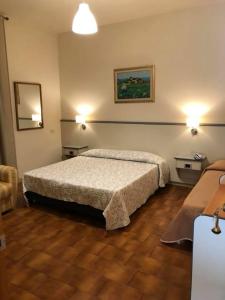 Postel nebo postele na pokoji v ubytování Hotel Ai Tufi