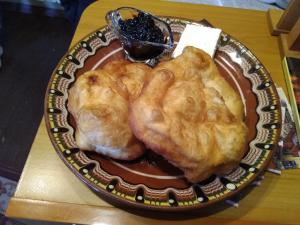 a plate with two pieces of food on a table at Guest House Todorini kashti in Koprivshtitsa