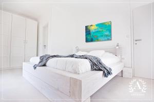 Postel nebo postele na pokoji v ubytování Villa Artemis + 24 fotografií