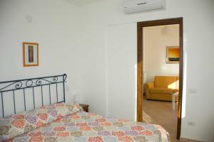a bedroom with a bed and a living room at B&B Sole Luna in Perugia