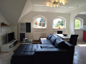 a living room with a couch and a table at Homburg in Limbach