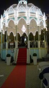 a large white building with a red carpet and stairs at Villa Brigida in Manduria