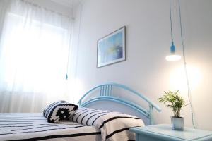 Łóżko lub łóżka w pokoju w obiekcie Eleatica Holiday Apartment