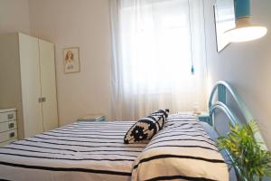 Łóżko lub łóżka w pokoju w obiekcie Eleatica Holiday Apartment