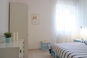 Łóżko lub łóżka w pokoju w obiekcie Eleatica Holiday Apartment