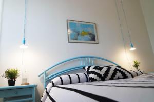 Łóżko lub łóżka w pokoju w obiekcie Eleatica Holiday Apartment