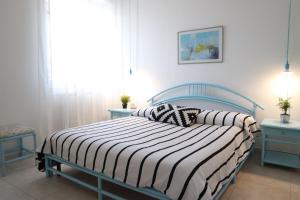 Łóżko lub łóżka w pokoju w obiekcie Eleatica Holiday Apartment