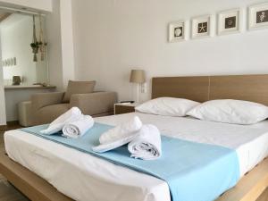 A bed or beds in a room at Alegria Kefalonia