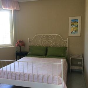Postel nebo postele na pokoji v ubytování Villa L'Ottagono con cucina parcheggio privato telecamerizzato e wifi