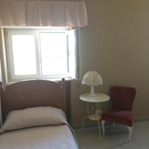 Postel nebo postele na pokoji v ubytování Villa L'Ottagono con cucina parcheggio privato telecamerizzato e wifi