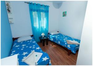 Postel nebo postele na pokoji v ubytování Apartments FRAGOLINA