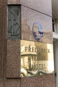 a building with a sign for a hotel at Frederick House Hotel in Edinburgh
