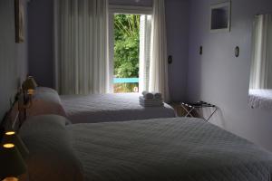 Кровать или кровати в номере Pousada Camponesa