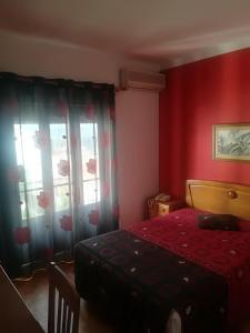 Postel nebo postele na pokoji v ubytování Hotel Conforto Latino