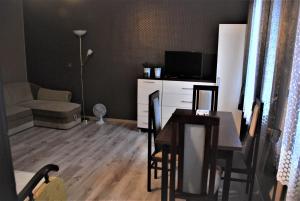 TV a/nebo společenská místnost v ubytování Łeba Apartament