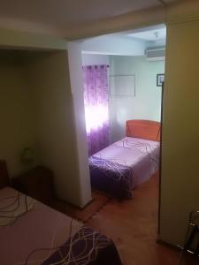 Postel nebo postele na pokoji v ubytování Hotel Conforto Latino