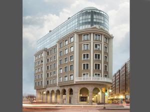 a rendering of a building with a glass dome at Apartamento Playa Poniente in Gijón