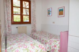 Postel nebo postele na pokoji v ubytování Casa Danilo