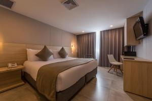 Ένα ή περισσότερα κρεβάτια σε δωμάτιο στο Hotel Barlovento