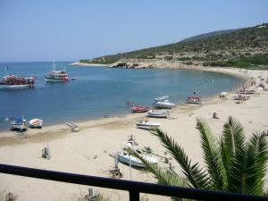 a view of a beach with boats in the water at Maries Seaside Home in Skala Marion